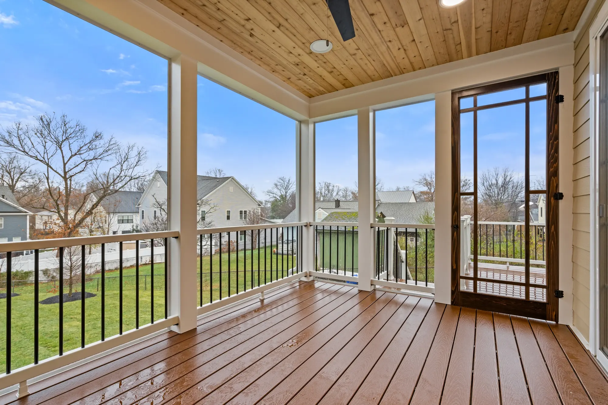 Screened-in porch with outdoor living space in Falls Church renovation