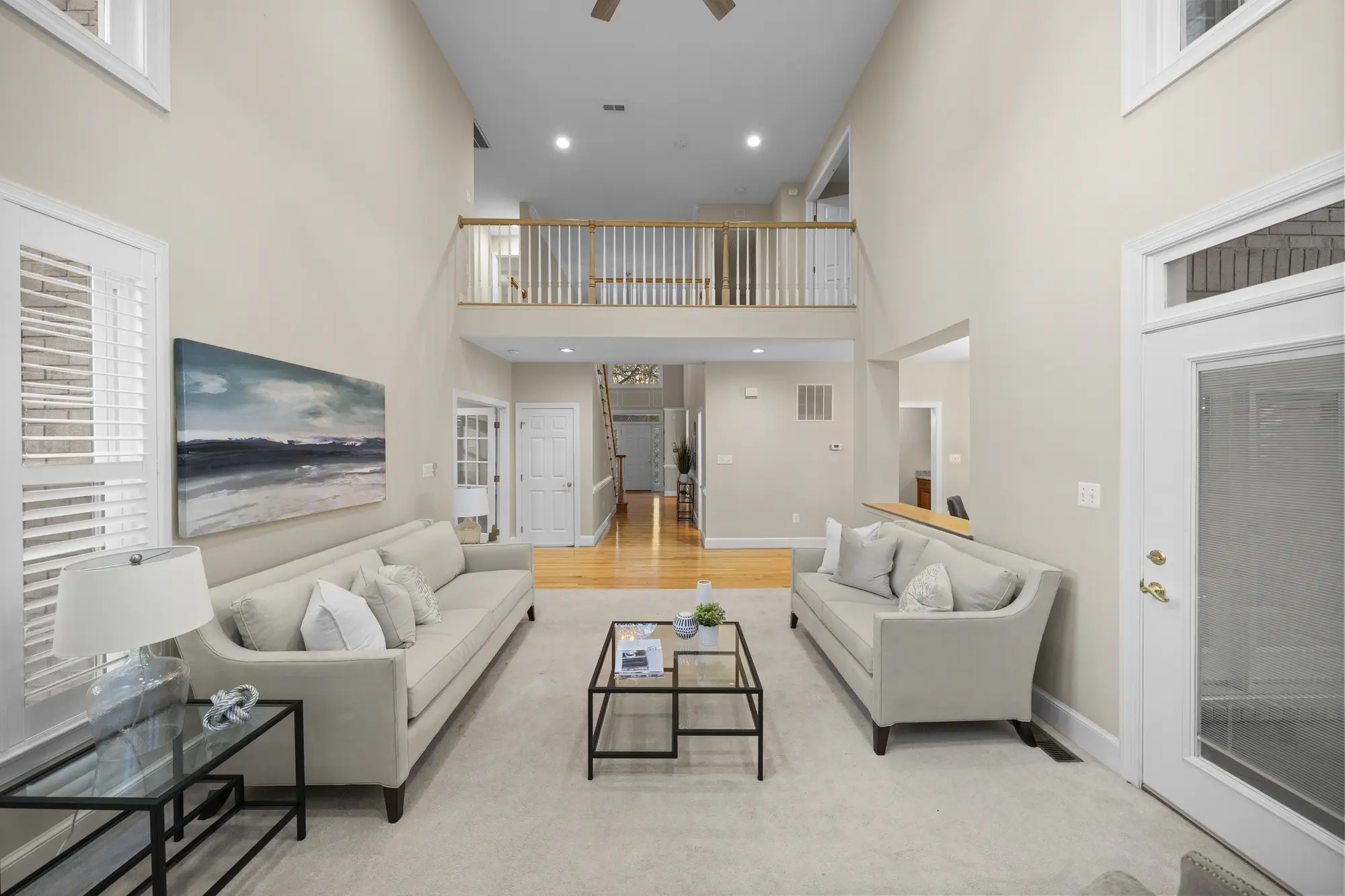 Spacious living room with balcony overlook and open layout