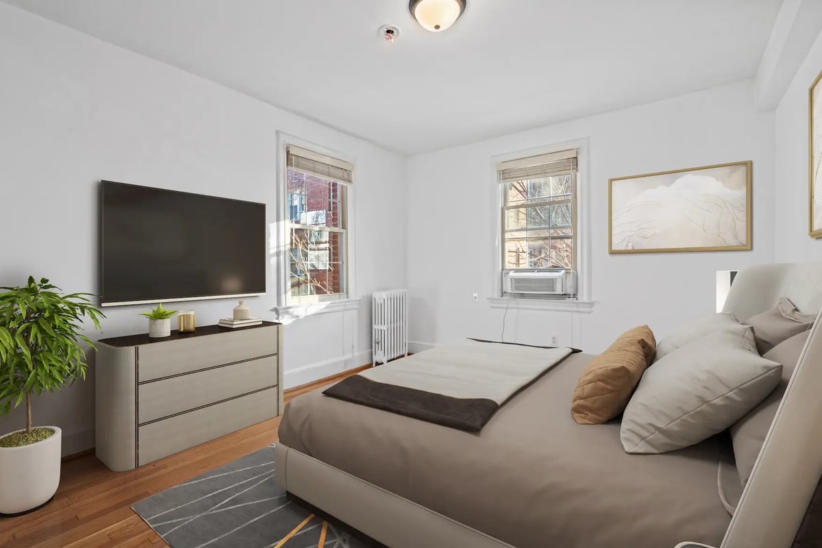 Beautifully staged bedroom with modern furniture — after virtual staging