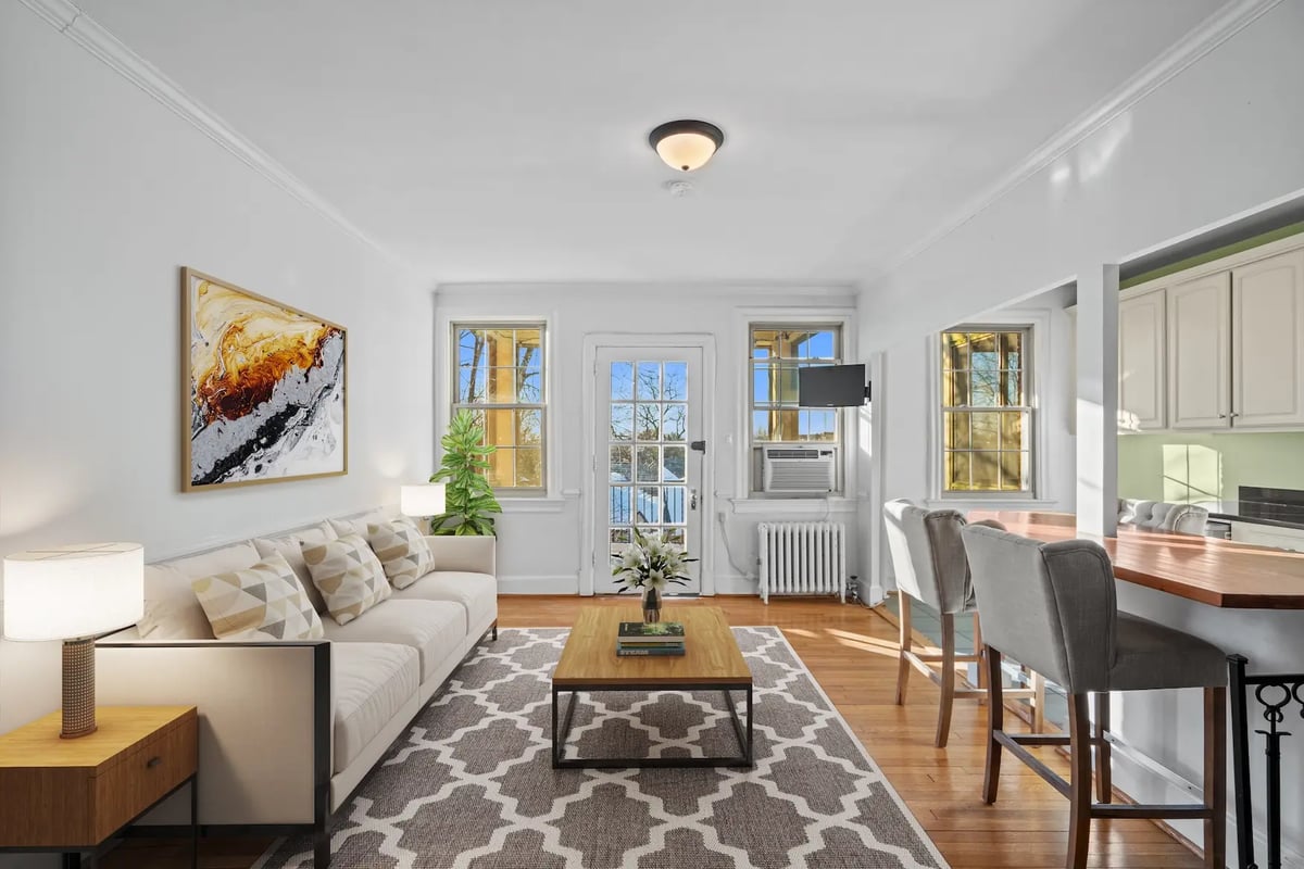 Furnished living room with sofa and decor — after virtual staging