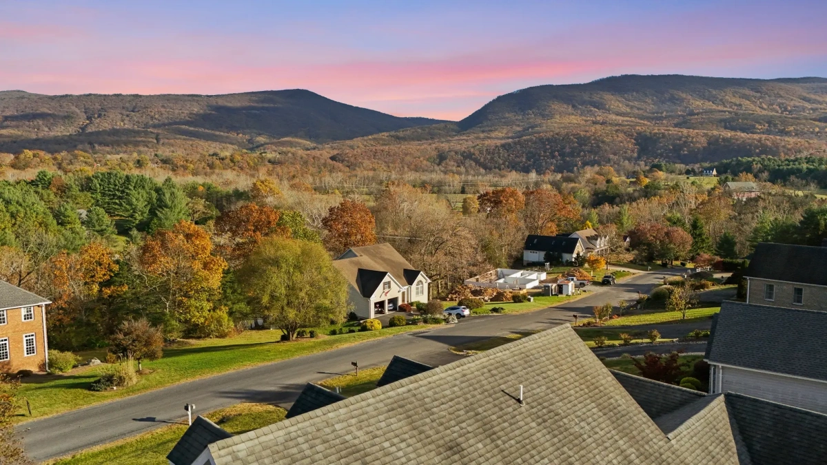 Mountain neighborhood at sunset captured by drone